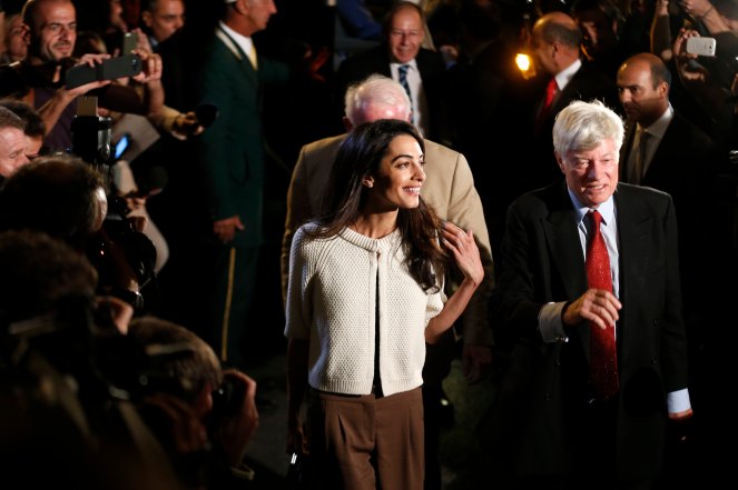 Human rights lawyer Amal Alamuddin Clooney and Geoffrey Robertson, head of Doughty Street Chambers, arrive at a hotel in Athens