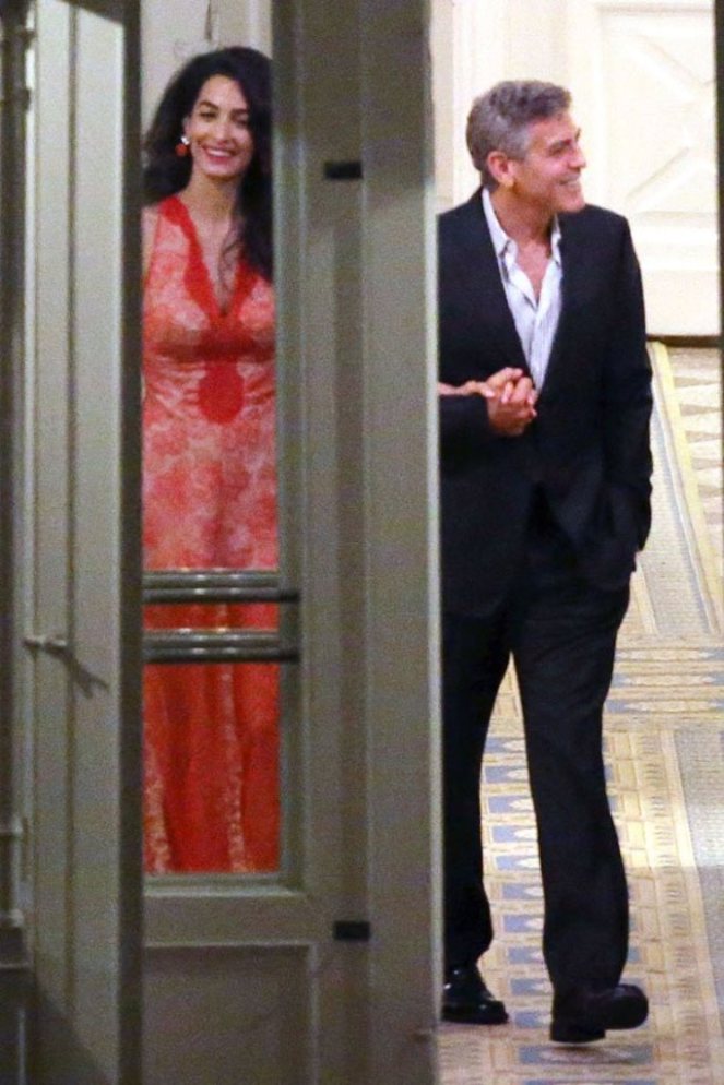**USA ONLY** London, UK - Amal Clooney and George Clooney show us that they're still deep in the throes of love as they were spotted having a romantic dinner at luxury hotel Ville D' Este in Italy. Amal wore a sexy sheer red gown that showed off her toned legs, and Clooney looked more than happy to show off his beautiful bride as he amped up the PDA. The two shared moonlight kisses while toasting to their love. AKM-GSI August 6, 2015 **USA ONLY** To License These Photos, Please Contact : Steve Ginsburg (310) 505-8447 (323) 423-9397 steve@akmgsi.com sales@akmgsi.com or Maria Buda (917) 242-1505 mbuda@akmgsi.com ginsburgspalyinc@gmail.com