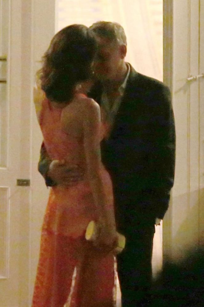 **USA ONLY** London, UK - Amal Clooney and George Clooney show us that they're still deep in the throes of love as they were spotted having a romantic dinner at luxury hotel Ville D' Este in Italy. Amal wore a sexy sheer red gown that showed off her toned legs, and Clooney looked more than happy to show off his beautiful bride as he amped up the PDA. The two shared moonlight kisses while toasting to their love. AKM-GSI August 6, 2015 **USA ONLY** To License These Photos, Please Contact : Steve Ginsburg (310) 505-8447 (323) 423-9397 steve@akmgsi.com sales@akmgsi.com or Maria Buda (917) 242-1505 mbuda@akmgsi.com ginsburgspalyinc@gmail.com