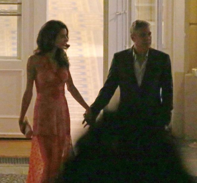 **USA ONLY** London, UK - Amal Clooney and George Clooney show us that they're still deep in the throes of love as they were spotted having a romantic dinner at luxury hotel Ville D' Este in Italy. Amal wore a sexy sheer red gown that showed off her toned legs, and Clooney looked more than happy to show off his beautiful bride as he amped up the PDA. The two shared moonlight kisses while toasting to their love. AKM-GSI August 6, 2015 **USA ONLY** To License These Photos, Please Contact : Steve Ginsburg (310) 505-8447 (323) 423-9397 steve@akmgsi.com sales@akmgsi.com or Maria Buda (917) 242-1505 mbuda@akmgsi.com ginsburgspalyinc@gmail.com