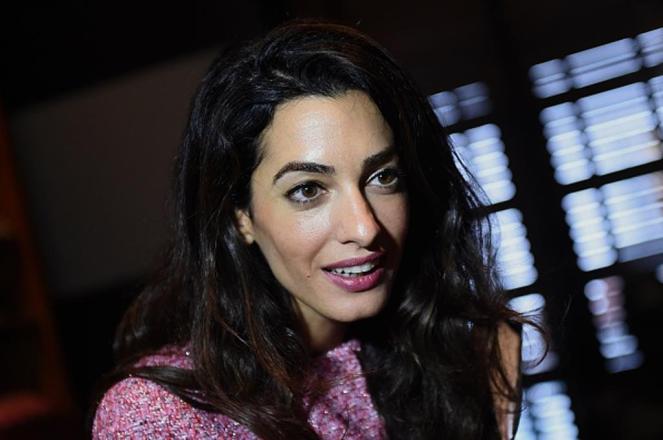 London-based human rights lawyer Amal Clooney meets members of the media at a hotel in the Sri Lankan capital Colombo on September 11, 2015. Clooney arrived from the Maldives where she spent four days pressing for the release of jailed former president Mohamed Nasheed. AFP PHOTO / Ishara S. KODIKARA (Photo credit should read Ishara S.KODIKARA/AFP/Getty Images)