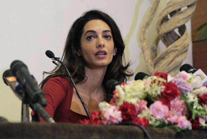 Human rights lawyer Amal Clooney speaks at a press conference at the Kurumba Maldives resort on the Maldives island of Vihamanafushi on September 10, 2015. Clooney attended a court hearing September 10 in the Maldives where state prosecutors have done a U-turn to appeal the conviction of former president Mohamed Nasheed. AFP PHOTO        (Photo credit should read STR/AFP/Getty Images)