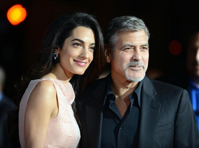 HOLLYWOOD, CA - OCTOBER 26: Attorney Amal Alamuddin and actor/producer George Clooney arrive for the Premiere Of Warner Bros. Pictures'