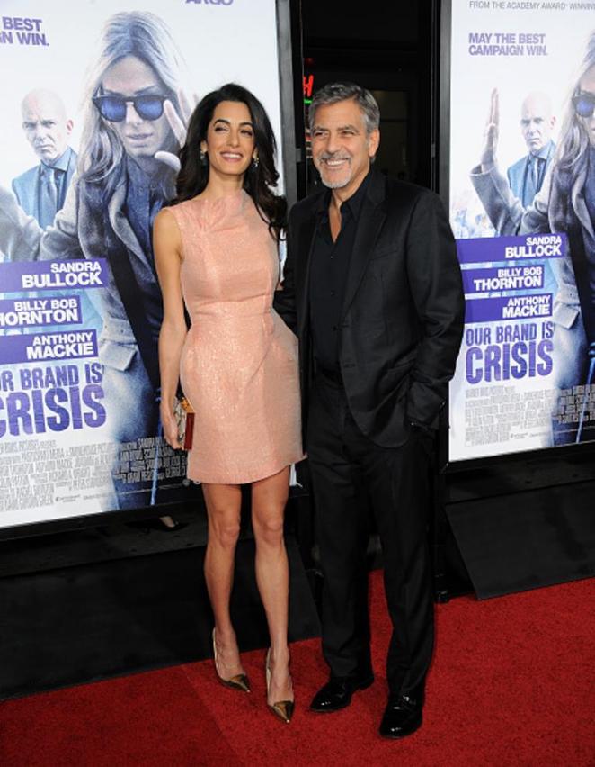 HOLLYWOOD, CA - OCTOBER 26: Attorney Amal Alamuddin and actor/producer George Clooney arrive for the premiere of Warner Bros. Pictures'