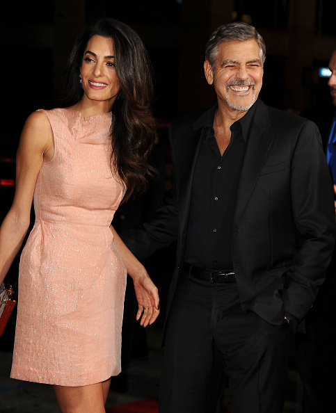 HOLLYWOOD, CA - OCTOBER 26: Amal Clooney and George Clooney attend the premiere of